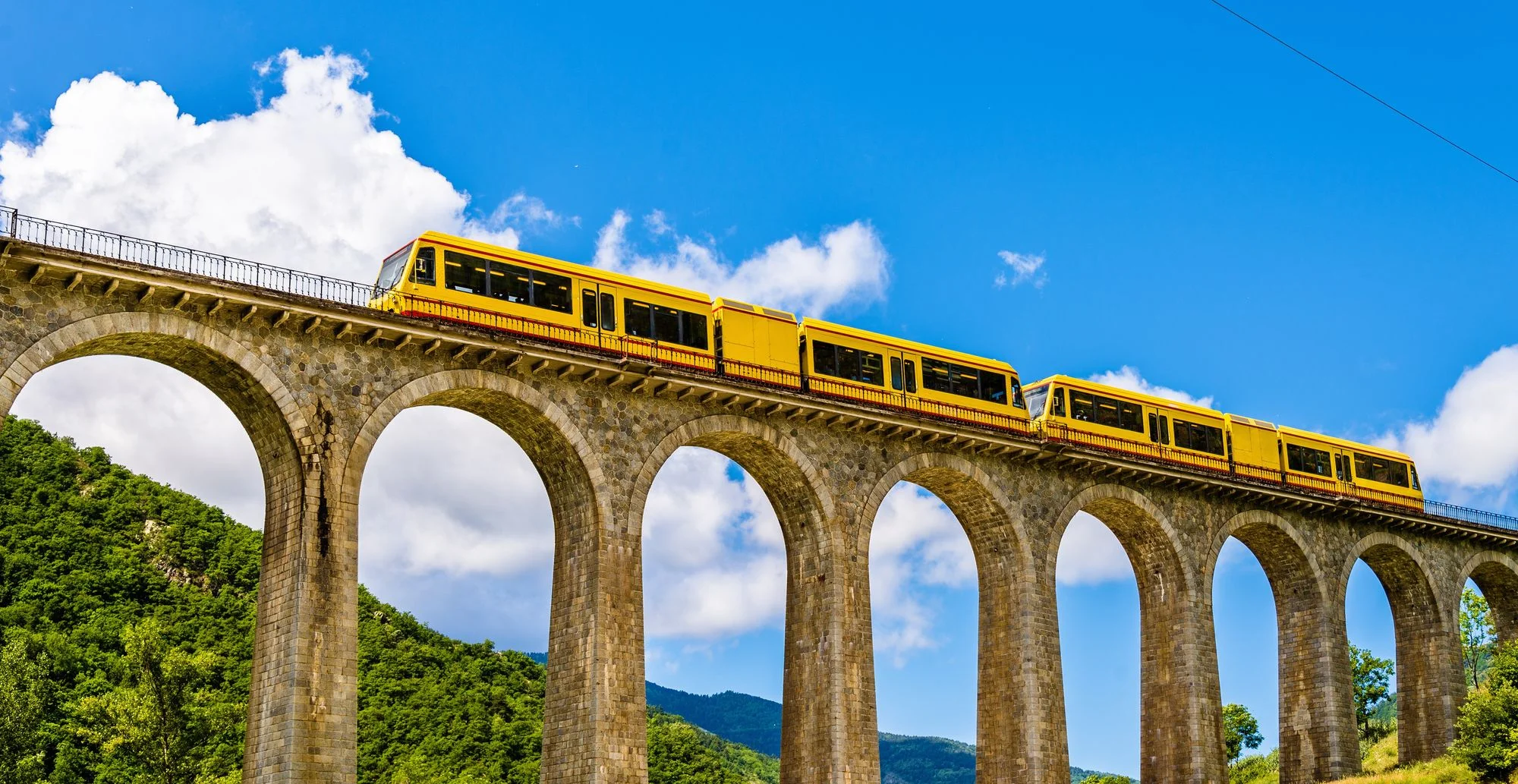 stock-photo-the-yellow-train-train-jaune-on-sejourne-bridge-france-pyrenees-orientales-318580949