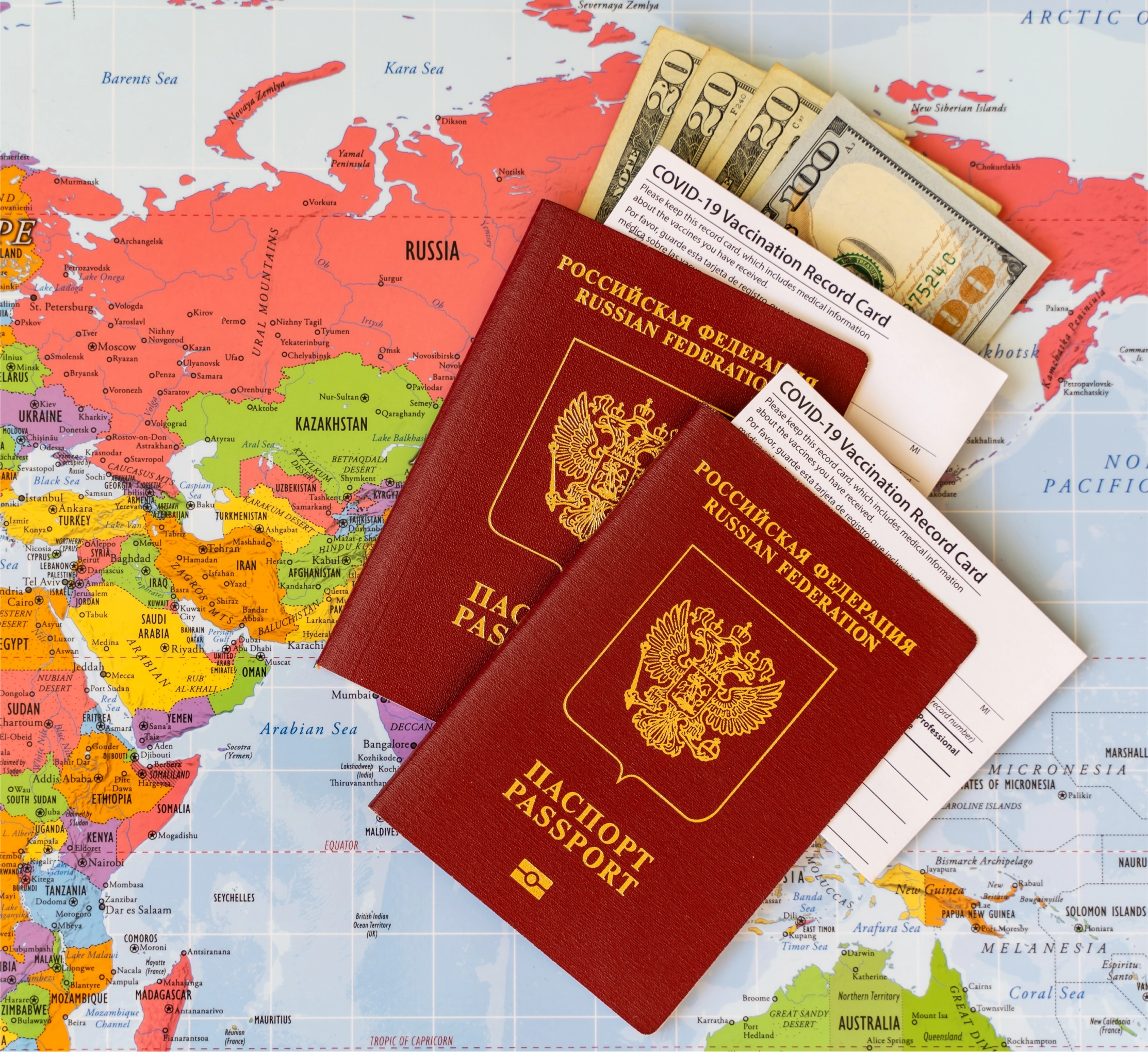 stock-photo-two-international-passports-of-the-russian-federation-with-ash-dollars-and-vaccination-record-2134398419 1аа